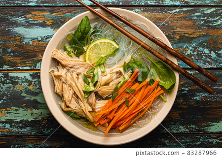 Asian soup with noodles in bowl top view 83287966