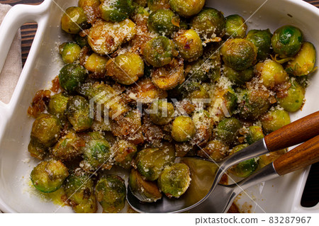 Vegetarian roasted brussels sprouts on wooden table Vegetarian roasted brussels sprouts on wooden table 83287967