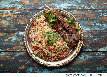 Arab Turkish kebab with tabbouleh salad 83287968