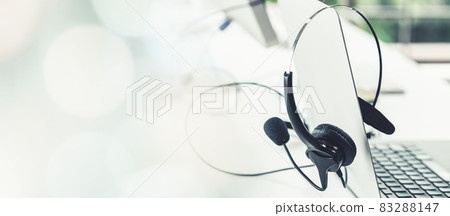 Headset and customer support equipment at call center ready for actively service 83288147