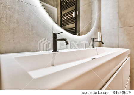 Close up of luxury faucet in an elegant bathroom Close up of luxury faucet in an elegant bathroom 83288699