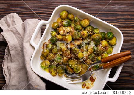Vegetarian roasted brussels sprouts on wooden table Vegetarian roasted brussels sprouts on wooden table 83288700