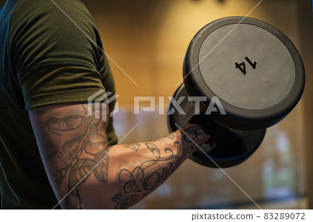 Davide Malfitano a fit handsom young Caucasian male works out in a gym. 83289072