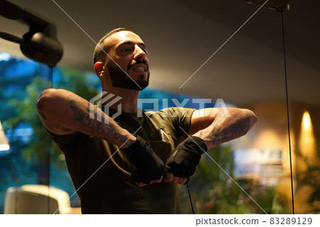 Davide Malfitano a fit handsom young Caucasian male works out in a gym. 83289129