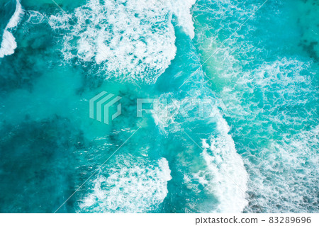 Blue ocean texture with waves and foam. La Digue Island, Seychelles Blue ocean texture with waves and foam. La Digue Island, Seychelles 83289696