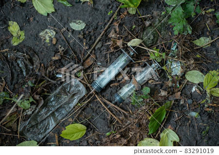 bunch of used dirty syringe leaved after drug injection lying on ground outdoor bunch of used dirty syringe leaved after drug injection lying on ground outdoor 83291019
