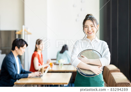 Young female clerk in a cafe Young female clerk in a cafe 83294289