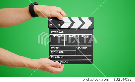 Chroma key composite image of the arm that rings the clapperboard 83296052