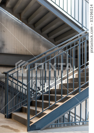 Evacuation iron staircase outside an old building Evacuation iron staircase outside an old building 83296814