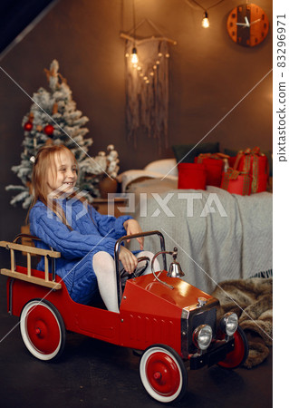 Little girl spends time in the holiday room 83296971