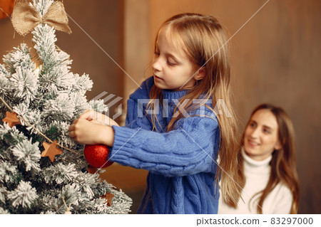 Mother with little daughter at home 83297000