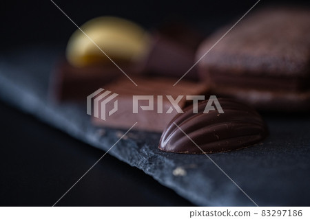 Chocolate black background close-up material 83297186