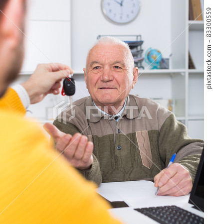 Man buying car in office Man buying car in office 83300559
