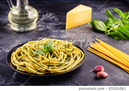 Pasta spaghetti with pesto sauce and fresh basil leaves Pasta spaghetti with pesto sauce and fresh basil leaves 83301061