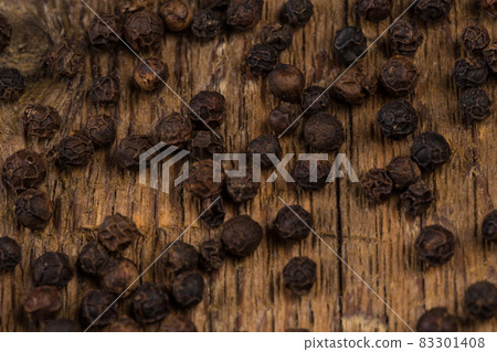 black pepper on wooden table black pepper on wooden table 83301408