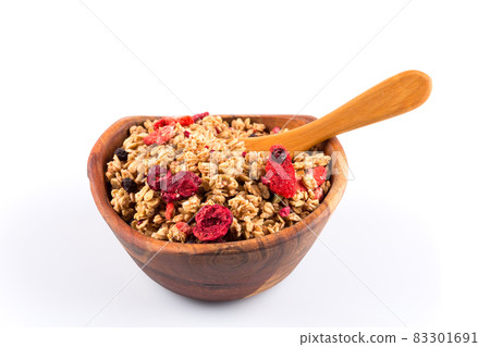 Muesli oat cereals close up background with dry fruits Muesli oat cereals close up background with dry fruits 83301691