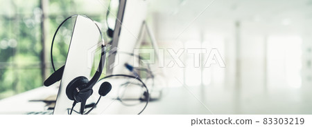 Headset and customer support equipment at call center ready for actively service 83303219