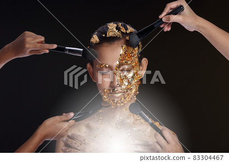 Gold Leaf High fashion style on Asian Woman Face dark mystery look Gold Leaf High fashion style on Asian Woman Face dark mystery look 83304467