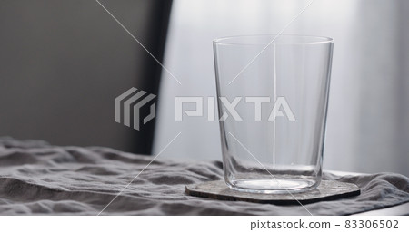 empty tumbler glass on linen cloth empty tumbler glass on linen cloth 83306502