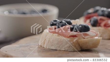 blueberries with prosciutto on ciabatta with cream cheese blueberries with prosciutto on ciabatta with cream cheese 83306532