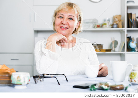 Mature woman at home Mature woman at home 83308037