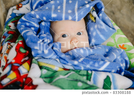 Newborn baby girl look with blue eyes on blanket Newborn baby girl look with blue eyes on blanket 83308188