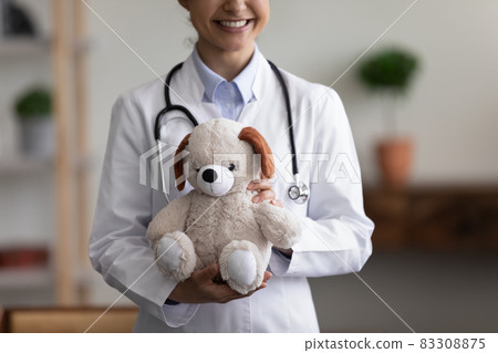 Happy smiling general pediatrician cropped shot portrait Happy smiling general pediatrician cropped shot portrait 83308875