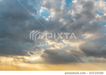 The cloudy beautiful sky with the light shining from the sun. The cloudy beautiful sky with the light shining from the sun. 83310580