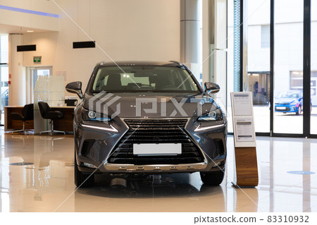new gray car in modern dealer showroom 83310932
