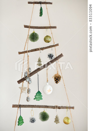 Handmade wooden Christmas tree hanging on the wall 83311094