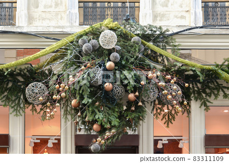 Decoration made from fir branches and golden balls Decoration made from fir branches and golden balls 83311109