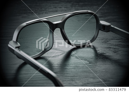 Smart glasses on black table. 83311479