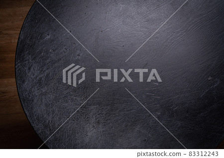 Empty black round wooden table Empty black round wooden table 83312243