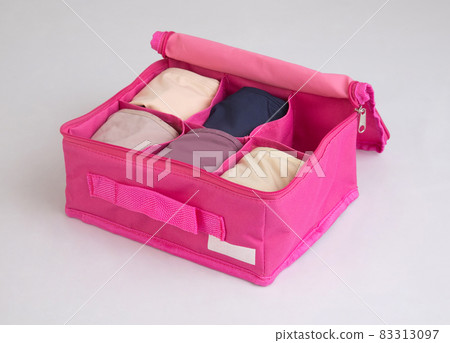 Fabric pink box for separate storage of underwear isolated on white Fabric pink box for separate storage of underwear isolated on white 83313097
