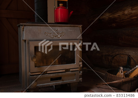 Fireplace and red kettle Fireplace and red kettle 83313486