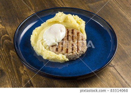 Traditional dish of mashed potatoes with fried pork cutlet and scrambled egg Traditional dish of mashed potatoes with fried pork cutlet and scrambled egg 83314068