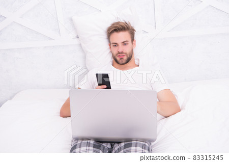 Communicate effortlessly. Handsome man read SMS Communicate effortlessly. Handsome man read SMS 83315245