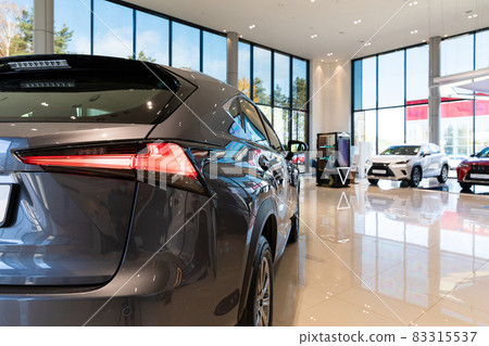 dealership car show of premium cars, in the foreground a gray SUV 83315537