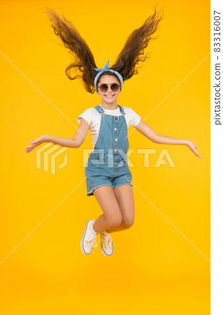Amazing long hair. Cute small girl with long hair jumping 83316007