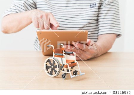 Senior with tablet Senior with tablet 83316985