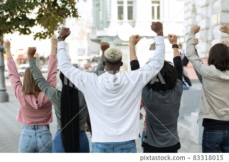 Back view of demonstrators making riot on the street 83318015