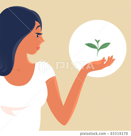 The girl holds a green sprout in her hands The girl holds a green sprout in her hands 83319178