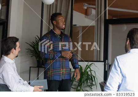 Serious young African American coach, presenter presenting project 83319523