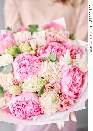 Beautiful bouquet of mixed flowers in woman hand. Floral shop concept . Handsome fresh bouquet. Flowers delivery. Beautiful bouquet of mixed flowers in woman hand. Floral shop concept . Handsome fresh bouquet. Flowers delivery. 83321463