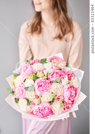 Beautiful bouquet of mixed flowers in woman hand. Floral shop concept . Handsome fresh bouquet. Flowers delivery. 83321464