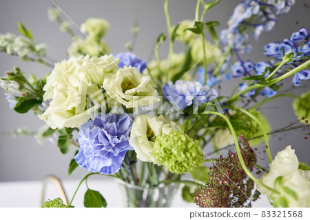 Finished flower arrangement in a vase for home. Flowers bunch, set for interior. Fresh cut flowers for decoration home. European floral shop. Delivery fresh cut flower. Finished flower arrangement in a vase for home. Flowers bunch, set for interior. Fresh cut flowers for decoration home. European floral shop. Delivery fresh cut flower. 83321568