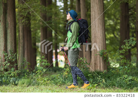 Young man enjoying a hike Young man enjoying a hike 83322418