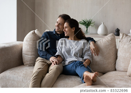 Relaxed smiling millennial couple enjoying leisure time. Relaxed smiling millennial couple enjoying leisure time. 83322696