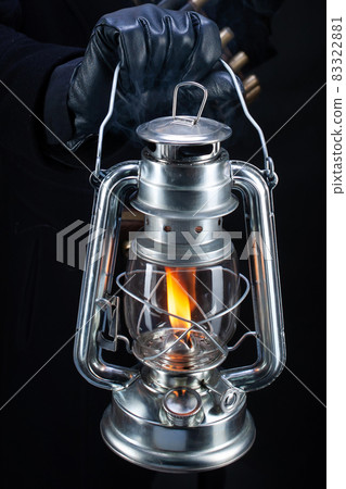 wild west blonde girl with cold blast kerosene lantern in hand and gun 83322881