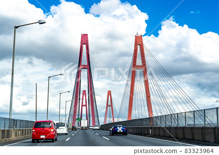 Trucks and passenger cars traveling on the Isewangan Expressway in Aichi Prefecture 83323964